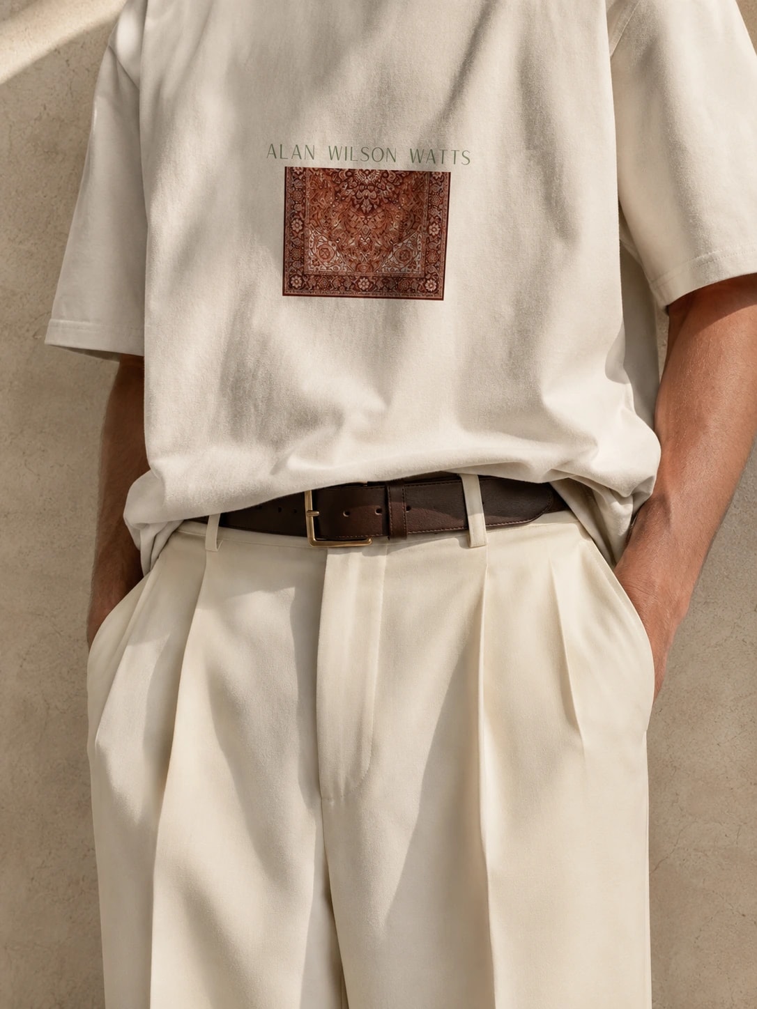 Close view of the woven carpet print across the front of the Alan Watts tee